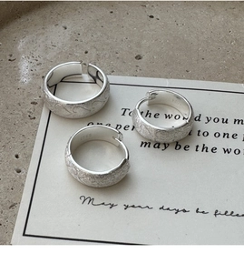 Detailed view of S925 sterling silver band showing brushed matte texture and hallmark