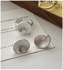 Detail view of S925 sterling silver jewelry set with matte finish and spiral design