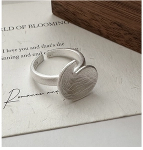 Macro shot of S925 sterling silver stamp on vintage matte textured heart ring