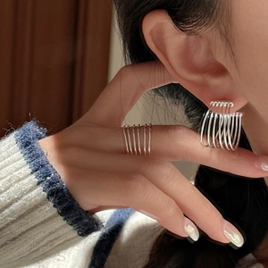 Minimalist S925 sterling silver multi-layer ear cuff and ring set shown on a model