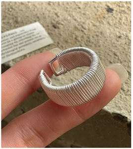 Detailed close-up of S925 sterling silver wide band ring with layered wire wrap design