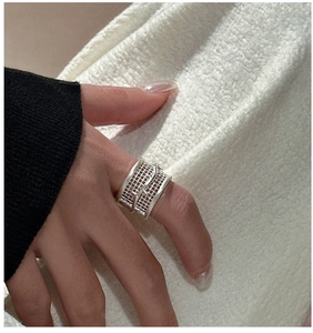 Detailed view of S925 sterling silver wide band ring featuring a 3D hollow grid design