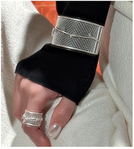 Detail of 3D textured mesh silver ring and cuff bracelet on model with a nature theme