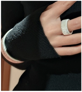 Close-up of S925 sterling silver ring with unique horizontal wire-wrapped texture