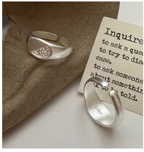 Detail of S925 sterling silver ring showing matte texture and S925 hallmark stamp