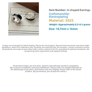 Close-up of S925 sterling silver U-shaped hoop earrings with black enamel detail