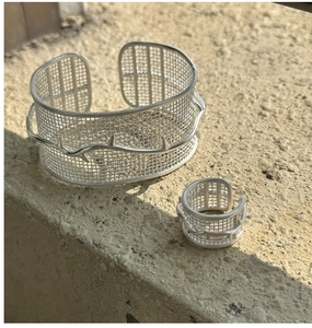 Close-up of S925 sterling silver mesh cuff bracelet and ring set with thorn branch design