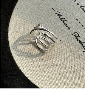 Detail view of a multi-layer S925 sterling silver ring with minimalist winding design
