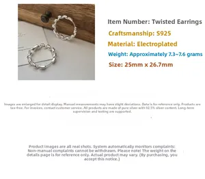 Detail view of S925 sterling silver twisted wave hoop earrings with 25mm diameter