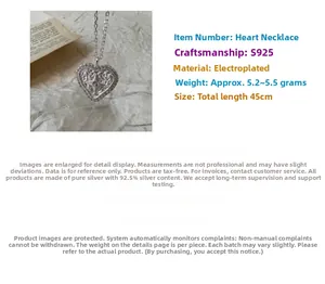 Detail view of S925 sterling silver heart pendant with star engraving and cubic zirconia