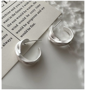 Detail view of S925 sterling silver hoop earrings with S925 hallmark engraving