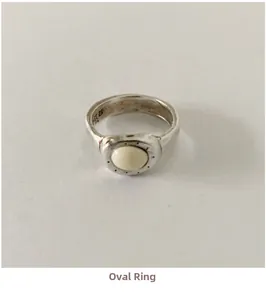 Macro shot of S925 sterling silver ring showing the vintage oval milky stone and inner hallmark