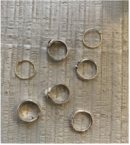 Detailed view of vintage S925 silver rings set with hammered texture and red gemstone
