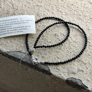 Minimalist S925 sterling silver beaded necklace with black beads and a floral cluster pendant