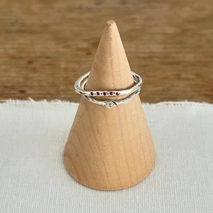 Handcrafted S925 sterling silver stacking ring set with red gemstones and hammered texture