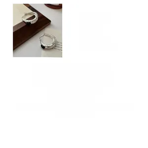 Detailed view of S925 sterling silver irregular earrings with oval black agate stones