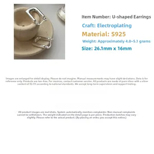 Macro detail of S925 sterling silver U-shaped earrings with minimalist electroplated finish