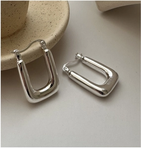 Close-up of S925 sterling silver square hoop earrings with polished metal finish