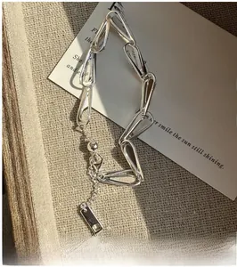 Detail of S925 sterling silver irregular teardrop link bracelet with adjustable chain