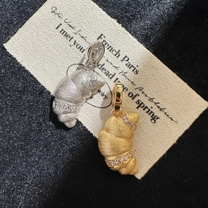 Brushed S925 silver and gold croissant pendants with fine cubic zirconia accents