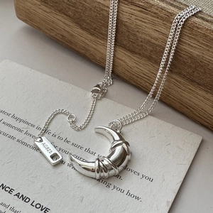 Elegant S925 sterling silver crescent moon pendant necklace with intricate wire wrap detail
