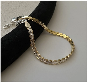 Detail of S925 sterling silver two-tone link chain with lobster clasp and extension
