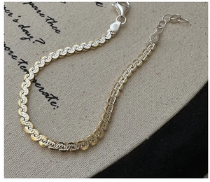 Detailed macro view of S925 sterling silver gourd chain with 925 hallmark and lobster clasp