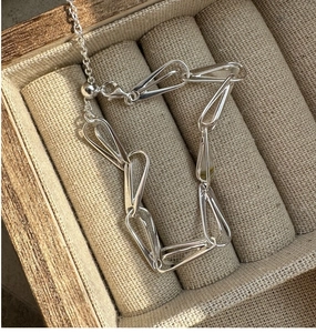 Detailed macro of S925 sterling silver geometric link bracelet with adjustable sliding clasp