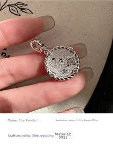 Close-up of S925 silver star pendant with textured surface and twisted rope edge details