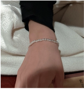 Close-up of minimalist S925 sterling silver beaded bracelet on wrist with retro style