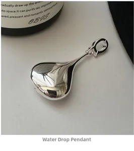 Macro shot of mirror-polished S925 sterling silver hollow teardrop pendant in 3D design