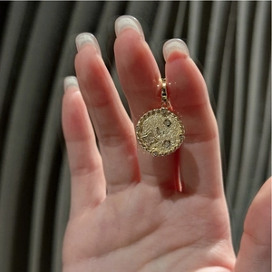 Detail of S925 sterling silver star pendant with retro hammered texture and small crystals