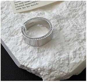 Macro detail of S925 sterling silver honeycomb ring with sparkling cubic zirconia inlay