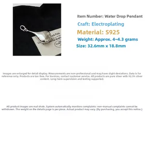 Macro detail of S925 sterling silver hollow waterdrop pendant with dimensions 32.6x18.8mm
