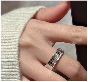 Macro detail of silver honeycomb textured ring featuring geometric hexagonal patterns