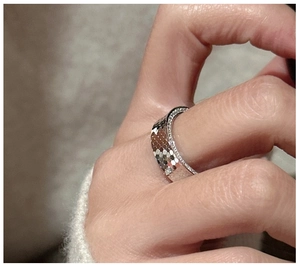 Detail of S925 silver honeycomb ring with crushed ice texture and side-set zircons