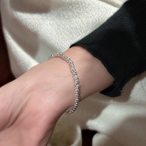 Minimalist S925 sterling silver beaded bracelet with vintage textured finish on wrist