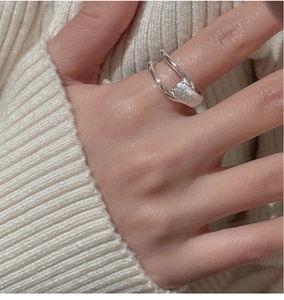 Detail of S925 sterling silver double-layered ring with a brushed matte texture finish