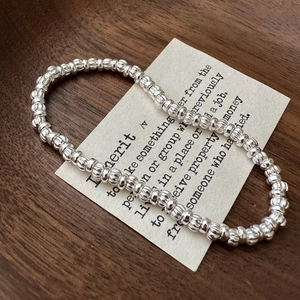 S925 sterling silver beaded bracelet with vintage pumpkin texture beads on wooden background