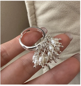 Macro view of adjustable S925 sterling silver ring with cluster of freshwater pearls