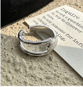 Macro detail of S925 sterling silver ring showing brushed texture and hallmark stamp