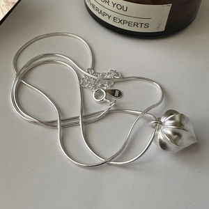 S925 sterling silver heart pendant necklace with matte texture on fine snake chain