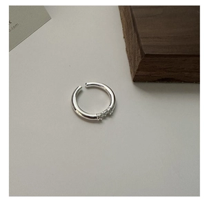 Macro detail of S925 sterling silver open ring featuring three-line textured band design