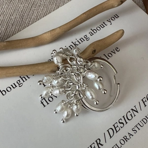 S925 sterling silver adjustable ring featuring dangling freshwater pearls on a wooden branch