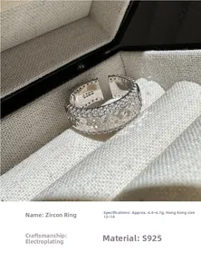 Macro shot of S925 silver zircon ring detailing the S925 engraving and textured band