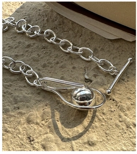 Detailed close-up of S925 sterling silver chain necklace with unique OT toggle clasp
