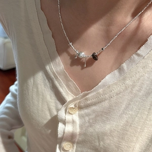 S925 sterling silver necklace featuring raw silver beads and a dark brown stone pendant