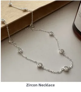 Macro view of S925 sterling silver chain necklace featuring bezel-set round cubic zirconia