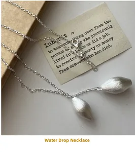 Macro view of S925 sterling silver water drop pendant with brushed matte texture finish