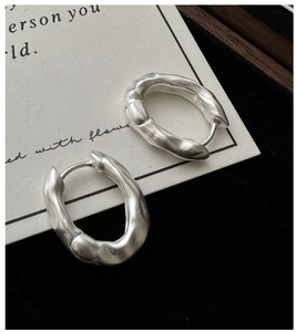 Macro shot of S925 sterling silver irregular textured earrings with matte finish